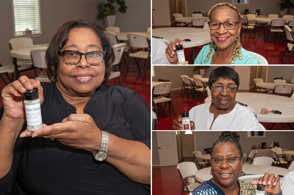 Four women holding spice bottles.
