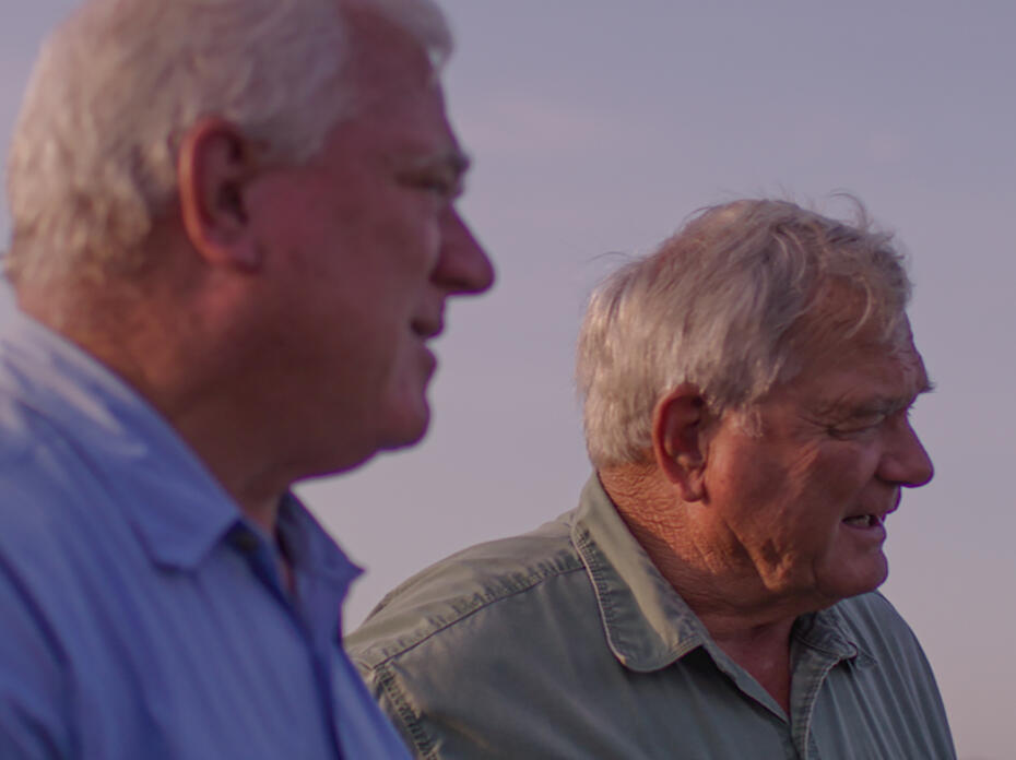 Two men are photographed outdoors.