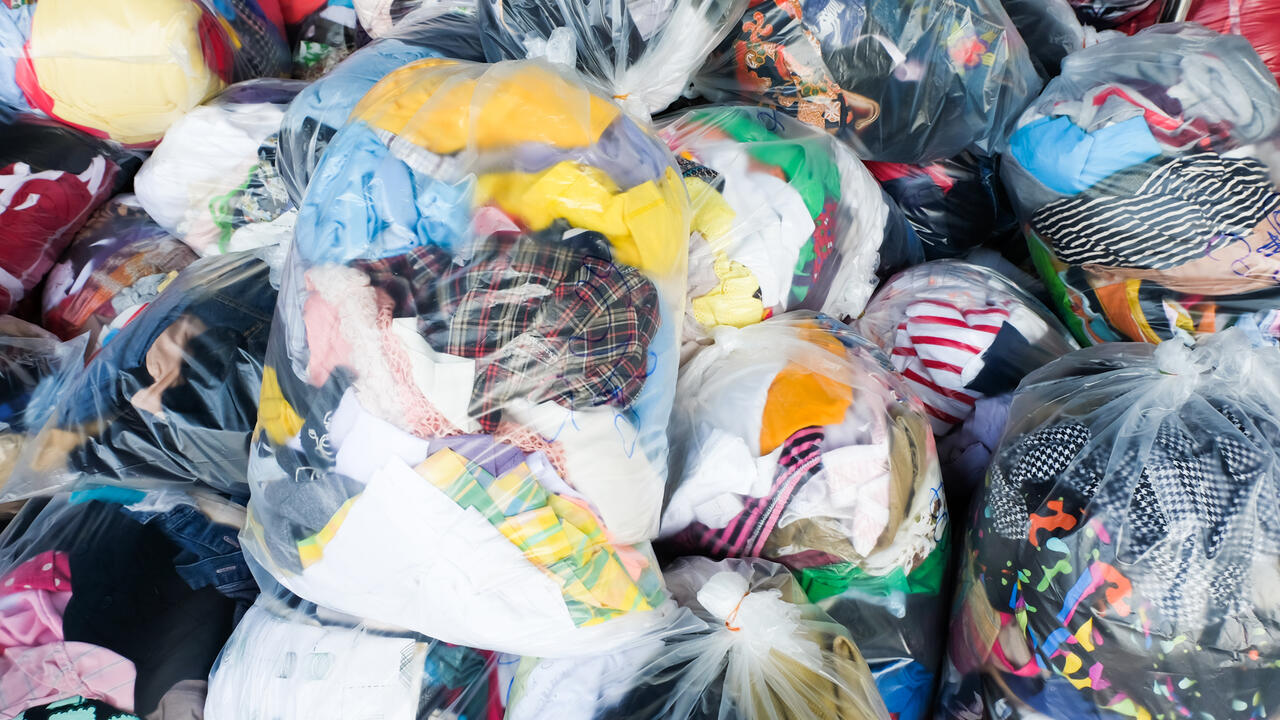 Bags are filled with used clothing.
