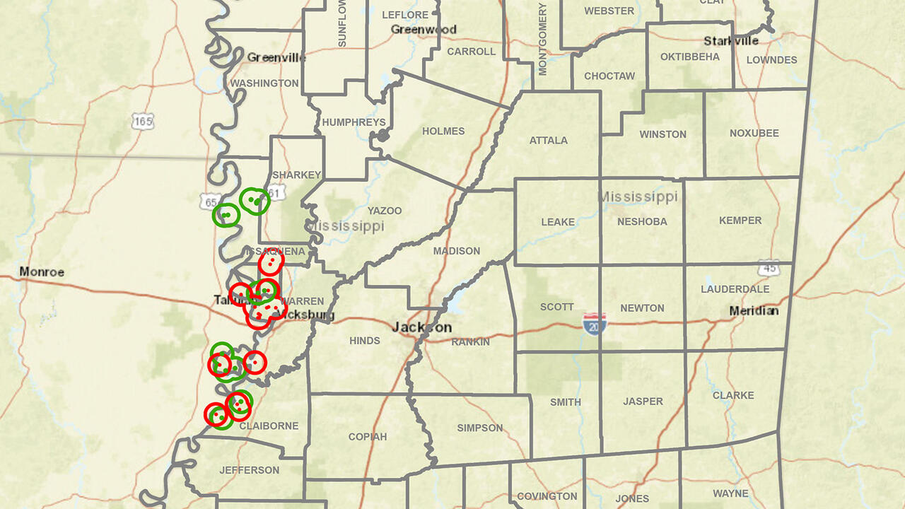 A map of Mississippi has data marked with red and green circles.