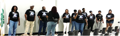 A group of choir members standing in a row