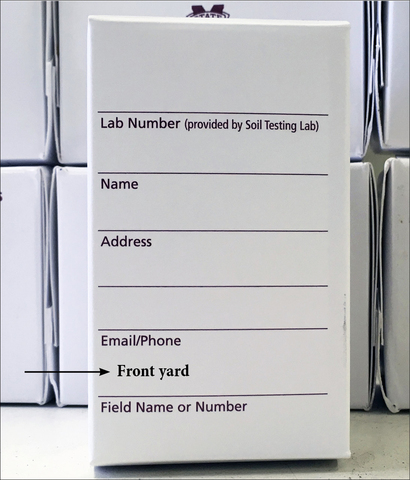 Soil sample container showing area for writing name, address, email/phone, and field name or number. The field name or number line has been filled in with the words "front yard."