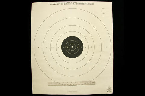 Official 23-Yard Timed and Rapid Fire Pistol Target with four white outer circles and three smaller inner black circles.